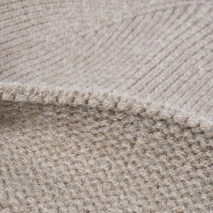 Beige ribbed knit beanie for men and women, featuring warm wool blend material