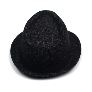 Detailed macro view showing the black cross-weave fabric texture and wide satin ribbon on hat