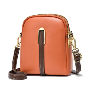 Chic orange PU leather crossbody bag with brown accents and elegant gold hardware