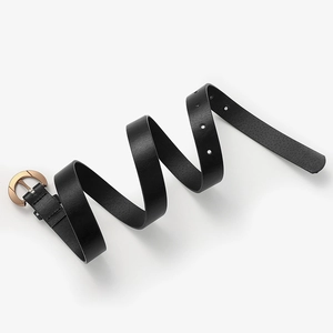 Modern black leather belt for women with elegant rose gold round buckle on white backdrop
