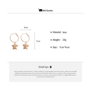 Rose gold iron hoop earrings with star pendants showing 7cm length and 4cm diameter