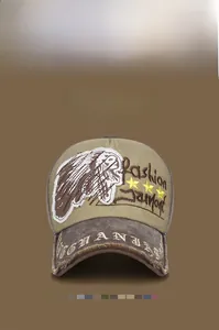 Detail of vintage baseball cap with Indian chief embroidery and distressed khaki canvas