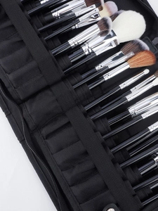 Macro view showing internal structure and elastic loops of the black makeup brush organizer