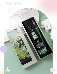 Detailed set of gradient glass dip pen with ink and pen rest in an elegant gift box