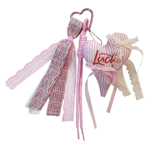 Pink lace tassel heart keychain, cute bow fabric stuffed heart bag charm main view.