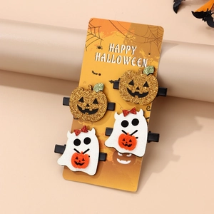 Set of four Halloween hair clips featuring glittery pumpkins and ghosts on card packaging