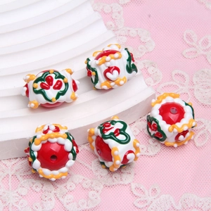 Five assorted hand-painted ceramic barrel beads with floral patterns for DIY jewelry making