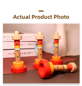 Close-up of four colorful painted wooden trumpet toys for toddlers' musical enlightenment