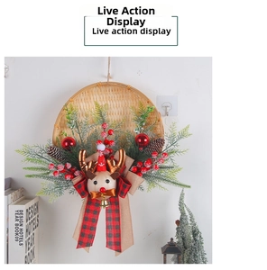 Close-up of Christmas reindeer wreath with pine needles, cones and plaid bow