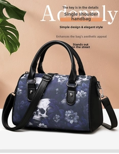 Detail of skull floral pattern on Oxford fabric Boston bag with silver hardware