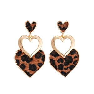 Leopard print heart drop earrings with golden metal tiers and soft fur texture style