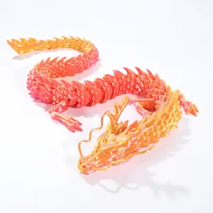 Detail of 3D printed articulated dragon with orange and pink gradient scales texture