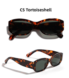 Detailed close-up of retro square tortoise sunglasses with green lenses and wide frame