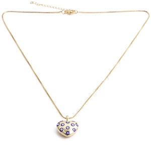 Detailed view of a gold heart pendant featuring blue evil eye patterns on a fine chain