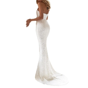 Detailed back view of white sequined mermaid evening gown with backless tie design