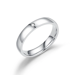 Polished silver titanium steel ring with a single round diamond on white background