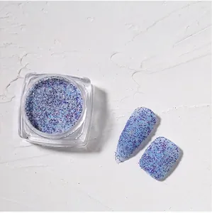 Macro view of blue and purple nail art sugar glitter powder and swatch effect