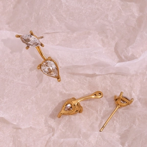 Detail of 18K gold earrings with teardrop and marquise crystals and adjustable posts