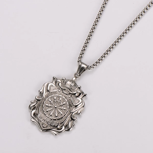 Detail view of silver stainless steel crown shield pendant with DARTS engraving and box chain