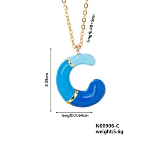 Detail view of blue enamel letter C pendant with dimensions 2.35cm and 40+5cm chain