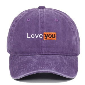 Detail of vintage washed purple baseball cap with Love You embroidery on front