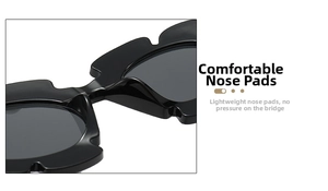Macro shot of stylish black sunglasses with comfy integrated nose pads and wavy edges