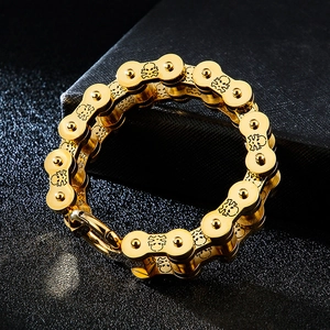 Macro shot of gold-plated hollow skull biker chain bracelet with detailed metal textures