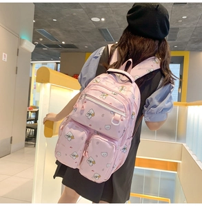 Pink school backpack featuring cute bear floral pattern and functional zipper pockets