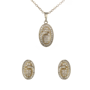Golden oval jewelry set with necklace and earrings featuring micro-paved cubic zirconia