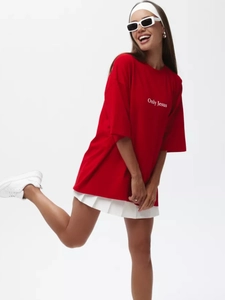 Close-up of Only Jesus lettering on a loose-fitting red cotton T-shirt for summer