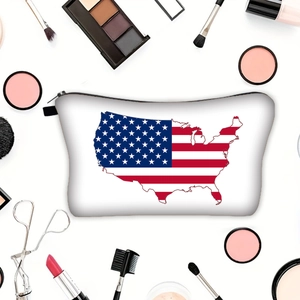 Portable white cosmetic bag featuring a USA map and flag design with makeup accessories