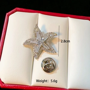 Macro view of starfish brooch with white zircons and dimensions 2.8cm diameter