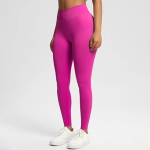 Close-up of high-waist rose red seamless yoga pants with premium elastic fabric detail