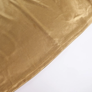 Detail of bronze velvet fabric showing high-quality double stitching and texture