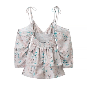 Detail of smocked back and layered ruffles on floral off-shoulder chiffon dress