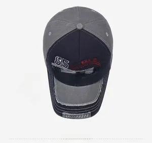 Top view of two-tone washed baseball cap with New York 85 embroidery and distressed edges