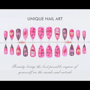 Detailed view of 24 almond press-on nails with red lips and cherry patterns