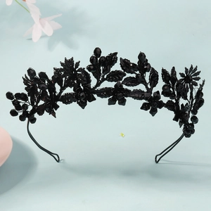 Detail of gothic black floral crown with crystals and metal leaves for Halloween