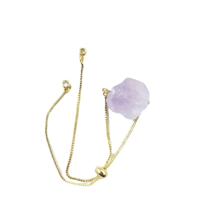 Adjustable gold chain bracelet featuring a raw irregular purple amethyst gemstone crystal