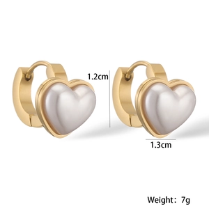 Detail view of gold heart hoop earrings showing 1.2cm height and 1.3cm width dimensions