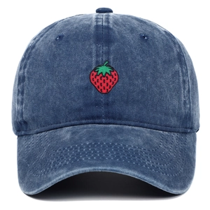 Detailed view of red strawberry embroidery on dark blue washed cotton baseball cap