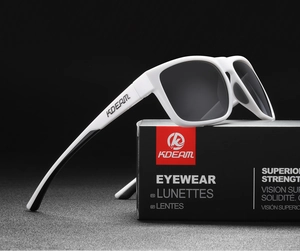 KDEAM polarized white sunglasses on black gift box with a focus on matte frame texture