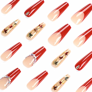 French maple leaf press-on nails with red glitter tips and sparkling rhinestones