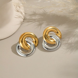 Close-up of interlocking gold and silver hoop earrings in high-quality stainless steel
