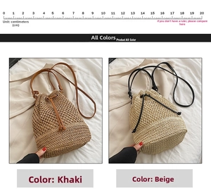 Detail view of woven straw bucket bag in khaki and beige with drawstring and leather strap