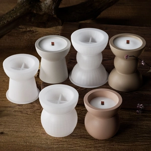 Detailed view of geometric silicone molds for DIY candle making with wooden wicks
