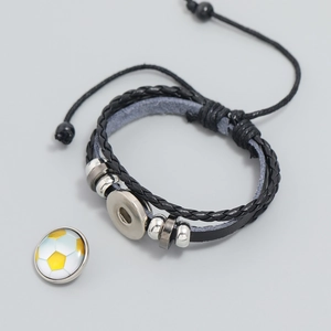 Detail of multi-layer black braided leather bracelet with soccer bead and adjustable cord