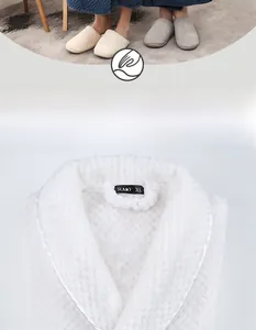 Detailed macro view of white waffle textured fleece robe collar with soft plush fabric