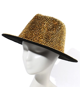 Detailed macro shot of gold rhinestone jazz hat with wide black brim for party