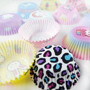 Colorful printed cupcake liners featuring leopard, unicorn, and rabbit patterns